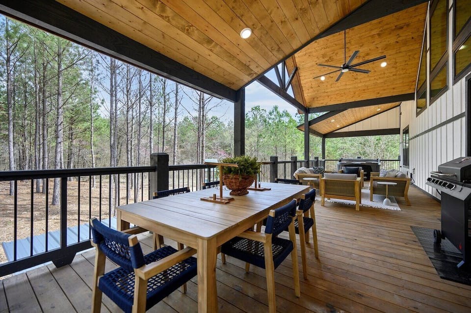 Huge back deck that connects to the breezeway. Perfect for grilling, outdoor dining, lounging around the propane fire pit, or soaking in the hot tub.