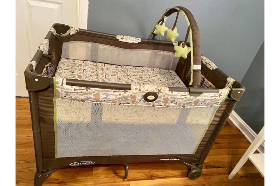 Pack and Play with 3” thick mattress.