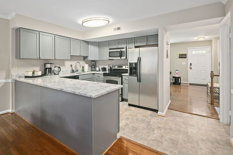 Kitchen peninsula extends additional counter space for meal prep