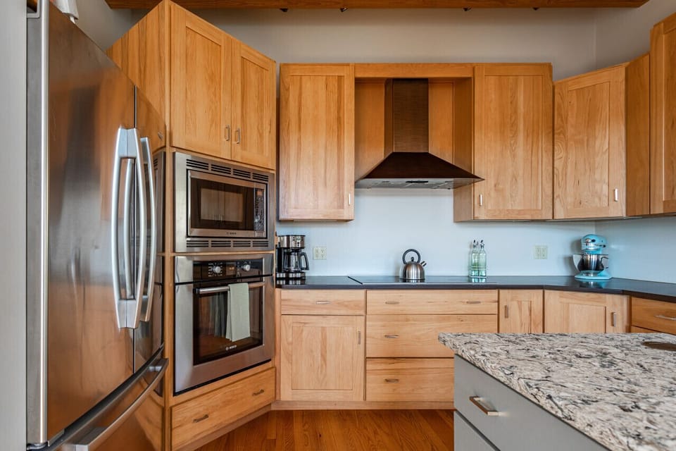 Kitchen includes new stainless steel appliances