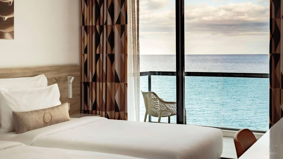 Family Room, Sea View | Minibar, in-room safe, blackout drapes, iron/ironing board