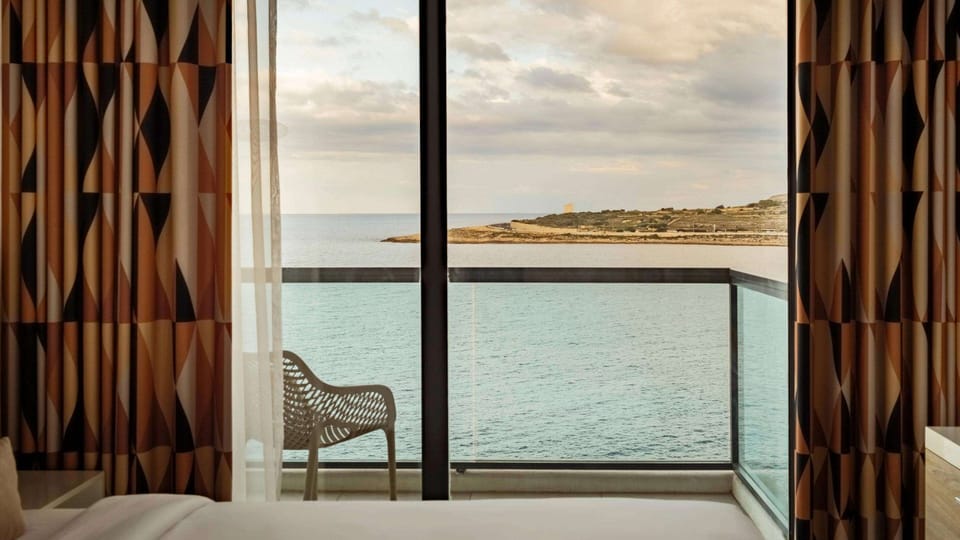 Family Room, Sea View | Minibar, in-room safe, blackout drapes, iron/ironing board