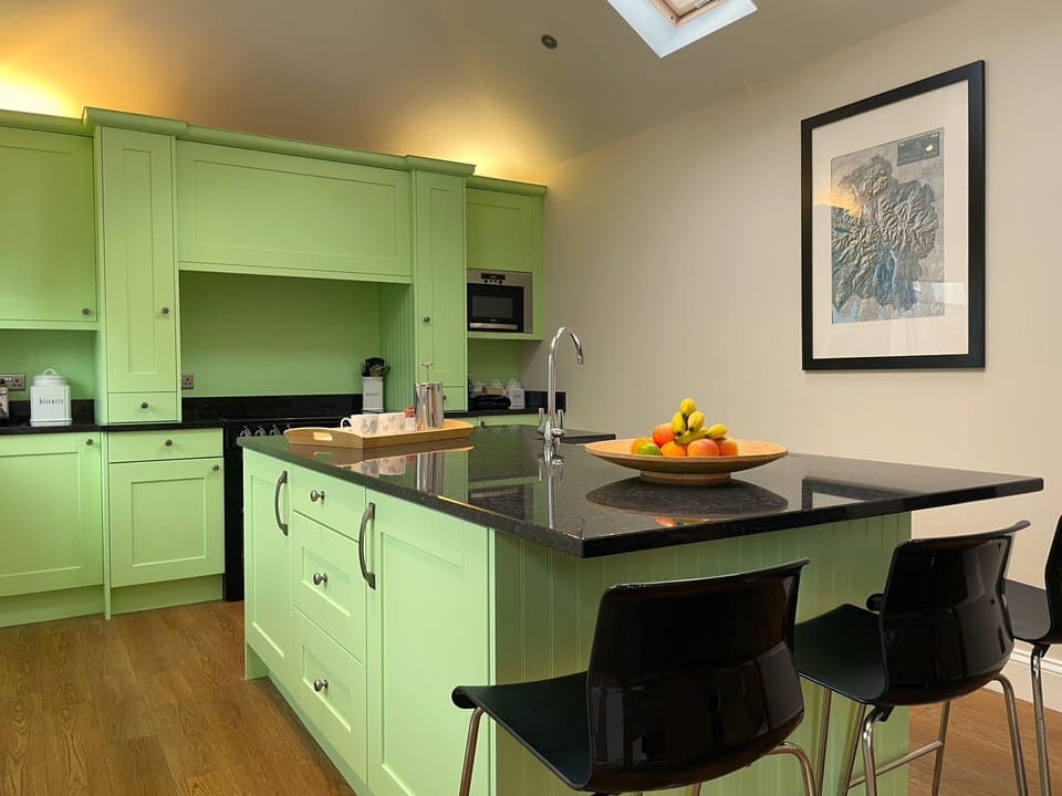 The bright airy kitchen is a lovely place to sit and enjoy your meals