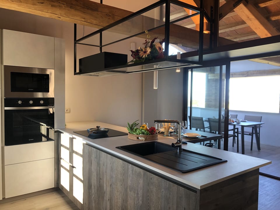 Luxury Apartment | Private kitchen | Full-size fridge, oven, stovetop, highchair