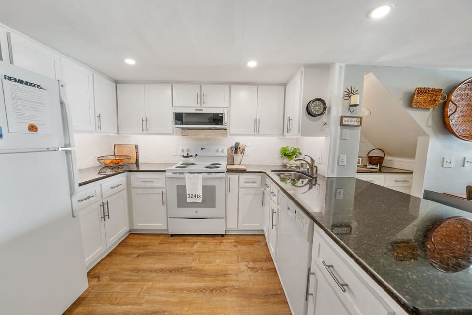 Cook your favorite meals in this spacious, fully-equipped kitchen with modern appliances and plenty of counter space for preparing memorable dinners together.