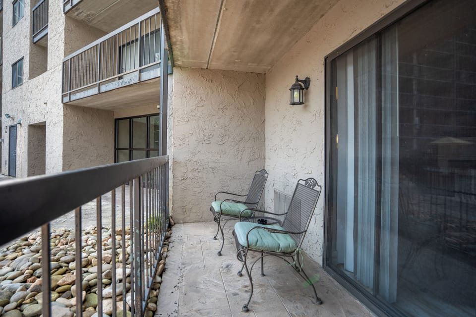 Your private balcony awaits with cushioned seating, perfect for morning coffee or evening relaxation in the open air.