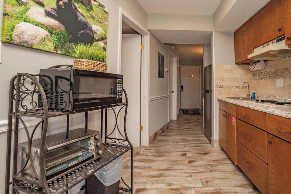 Step into your well-equipped kitchen, complete with granite countertops, modern appliances, and all the conveniences you need to whip up your favorite meals during your stay.