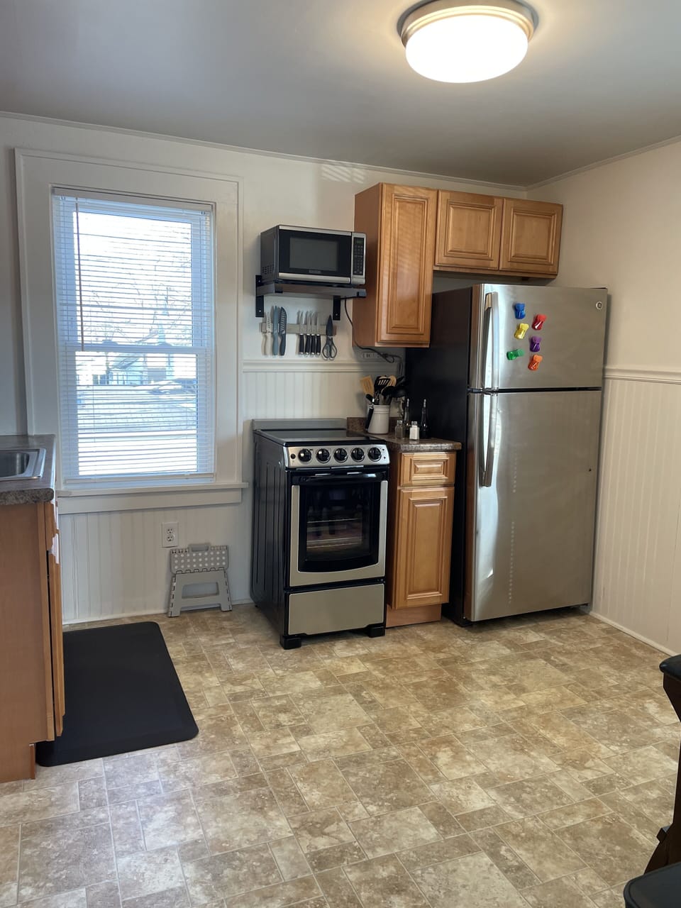 Kitchen equipped with stainless steel appliances and cooking needs