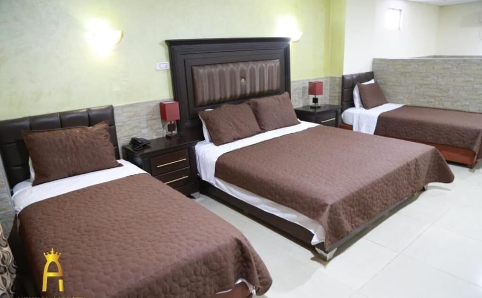 Deluxe Quadruple Room, 1 Bedroom, City View | WiFi (free), bed sheets