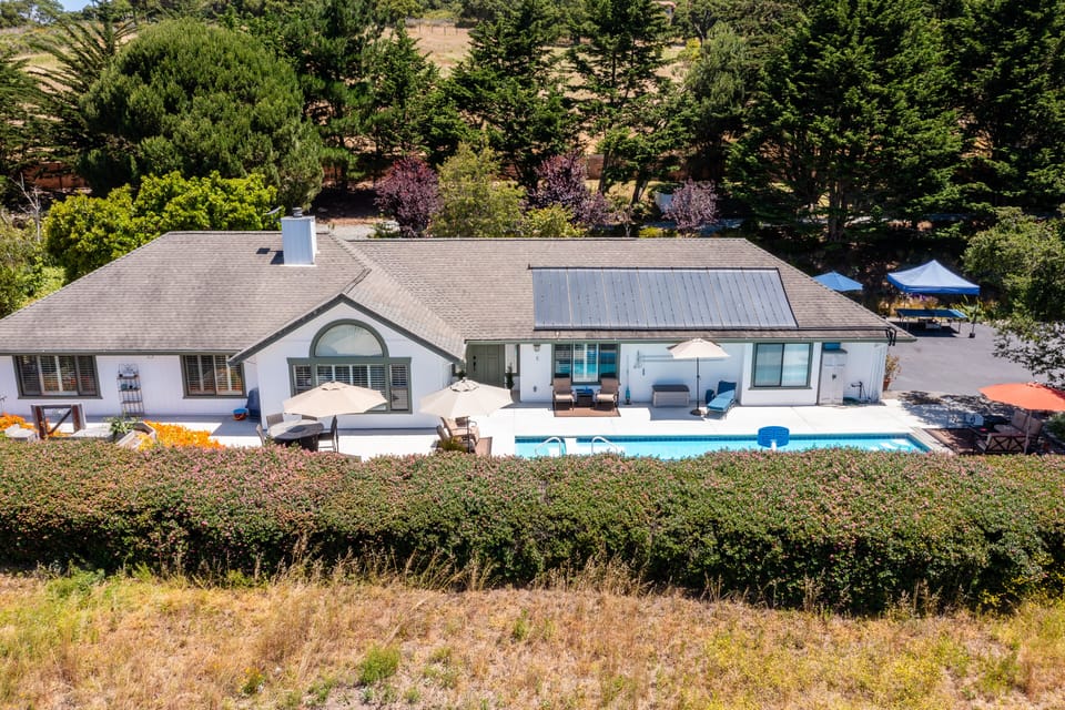With over an acre of fenced and private land, this home is it's own retreat.