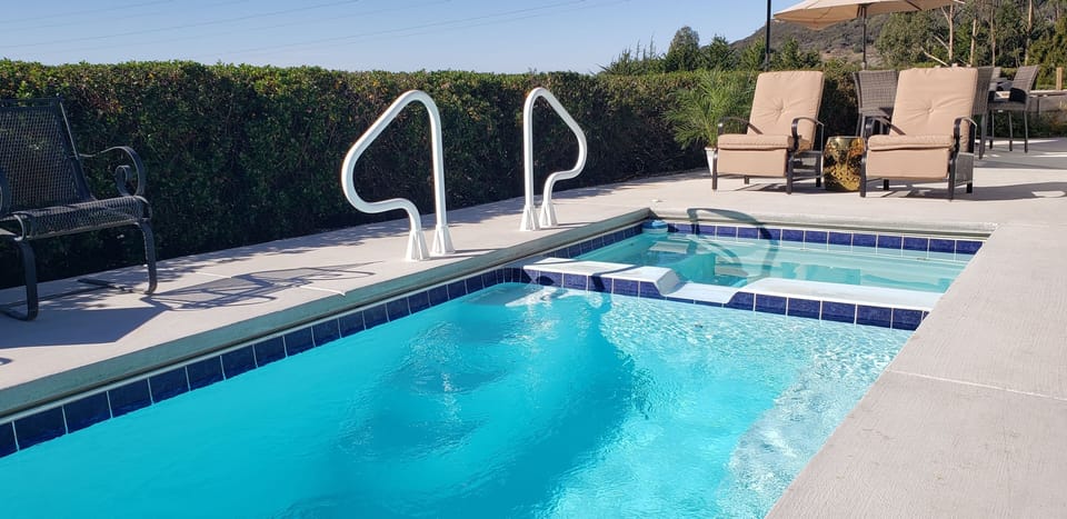 Soak up the warm California sun in these comfortable recliners near the hot tub.