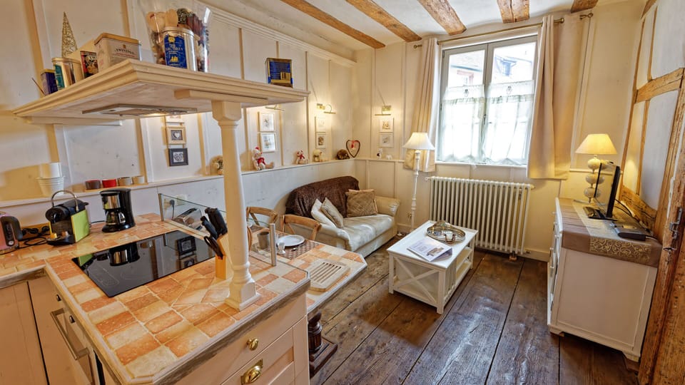 The kitchen area and the lounge area are in the same living space.
