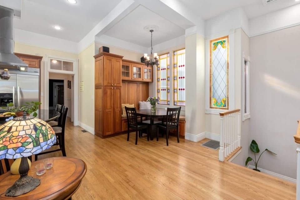 View of the breakfast nook with kitchen table. The open-style kitchen fosters conversation and togetherness during food preparation and serving. 