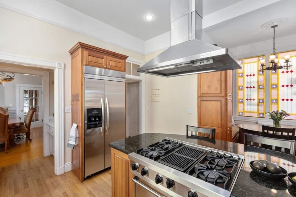 Gourmet open kitchen fit for a chef. Enjoy the Viking stove and the refrigerator and freezer with built-in ice and water dispenser. 