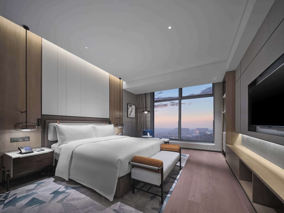Premium bedding, down comforters, desk, laptop workspace