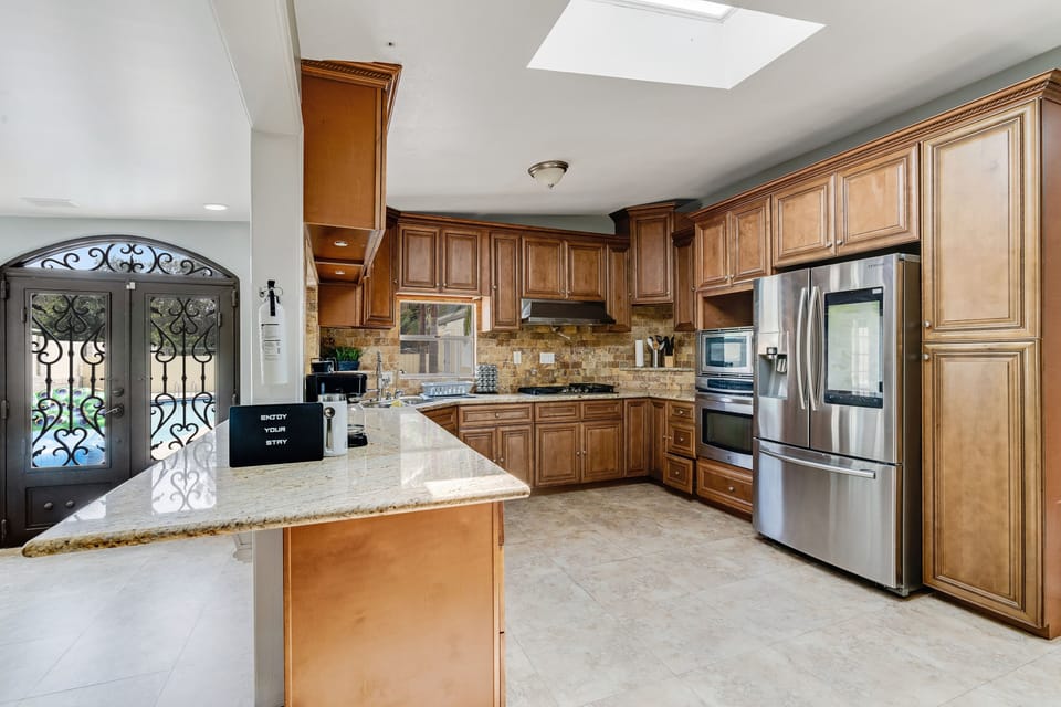 Modern kitchen with stylish bar, perfect for dining and culinary fun.