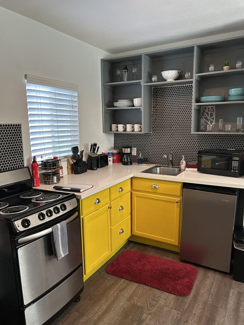 Stove, oven and microwave, small refridgerator.