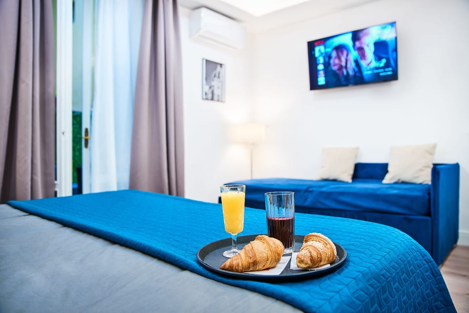 Deluxe Quadruple Room, Multiple Beds | Terrace/patio