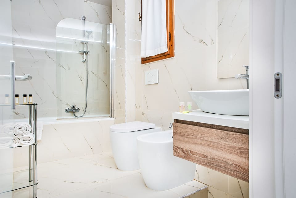 Family Room, 1 Bedroom | Bathroom | Combined shower/tub, rainfall showerhead, hair dryer, bathrobes