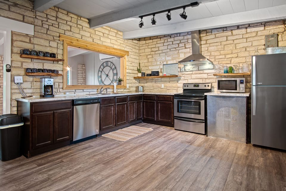 Full kitchen with stainless steel appliances