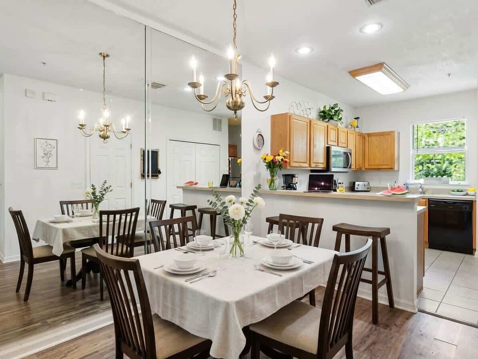 Spacious dining area with seating for six and open kitchen access—ideal for shared meals and conversation.