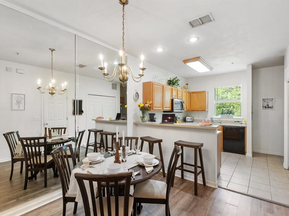 Spacious dining area with seating for six and open kitchen access—ideal for shared meals and conversation.