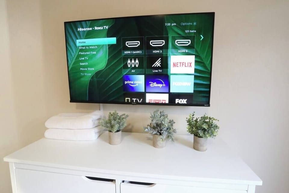 Large Hisense Roku Smart TV with pre-installed streaming apps.