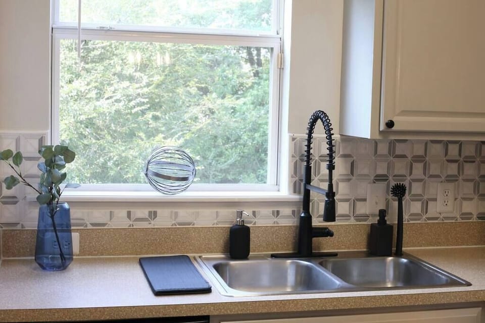 Enjoy modern convenience with our updated kitchen fixtures. The deep double sink and professional-grade faucet make prep and cleanup a breeze.