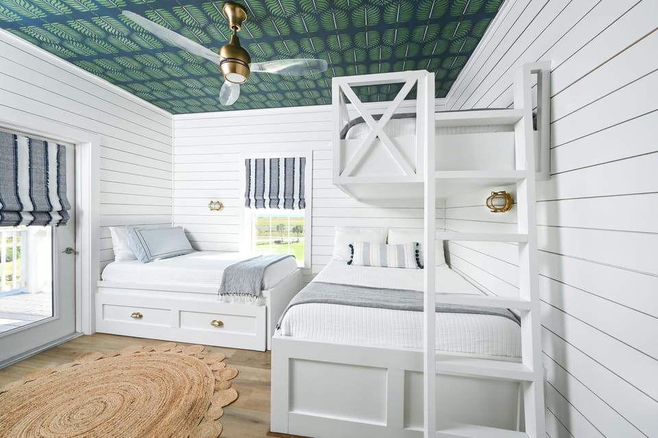 Kids room has plenty of space and a balcony to look out to the water.