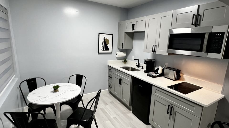 Kitchenette is equipped with mini fridge, microwave, toaster, coffee machine