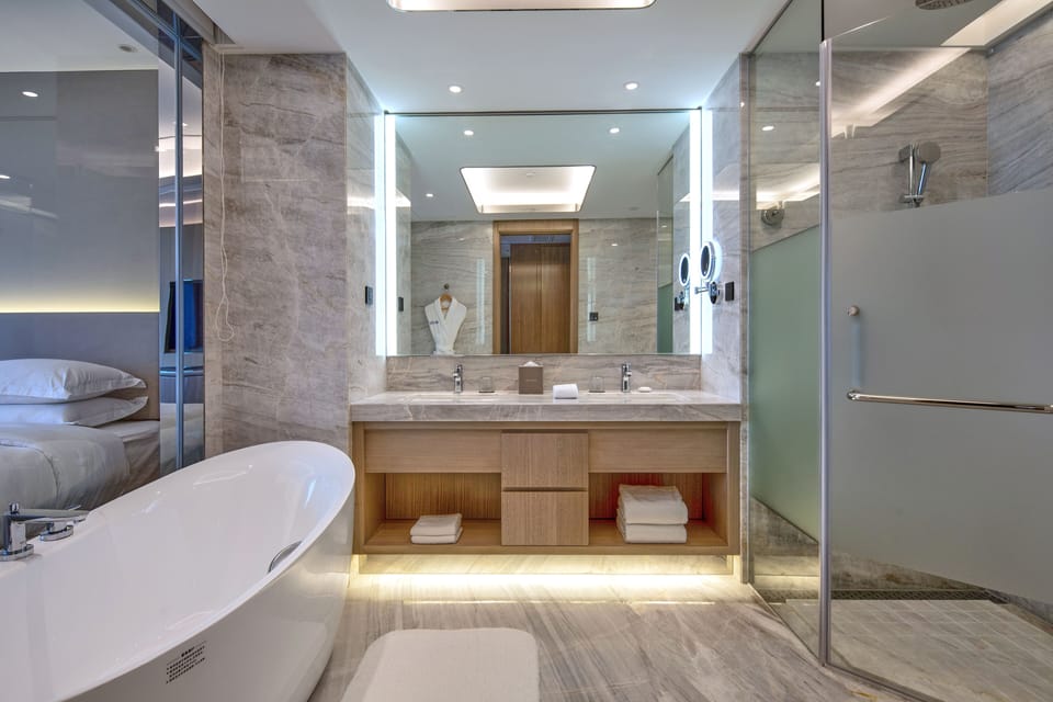 Exclusive Room, 2 Twin Beds, City View | Bathroom | Combined shower/tub, rainfall showerhead, hair dryer, bathrobes