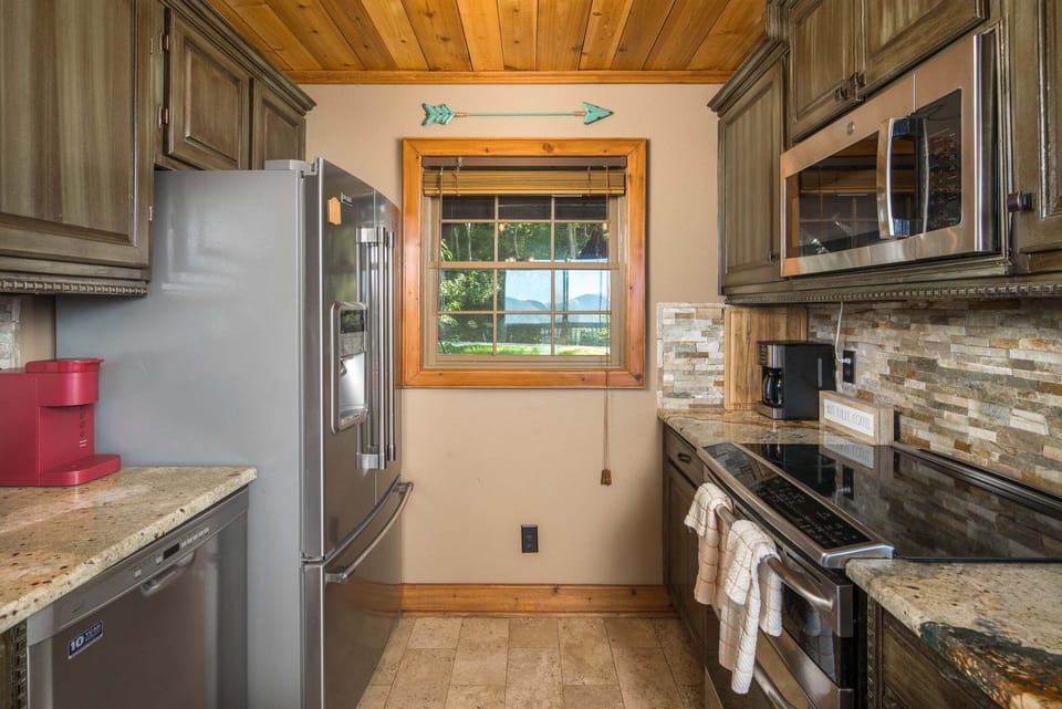 Fully equipped kitchen with granite countertops and stainless steel appliances