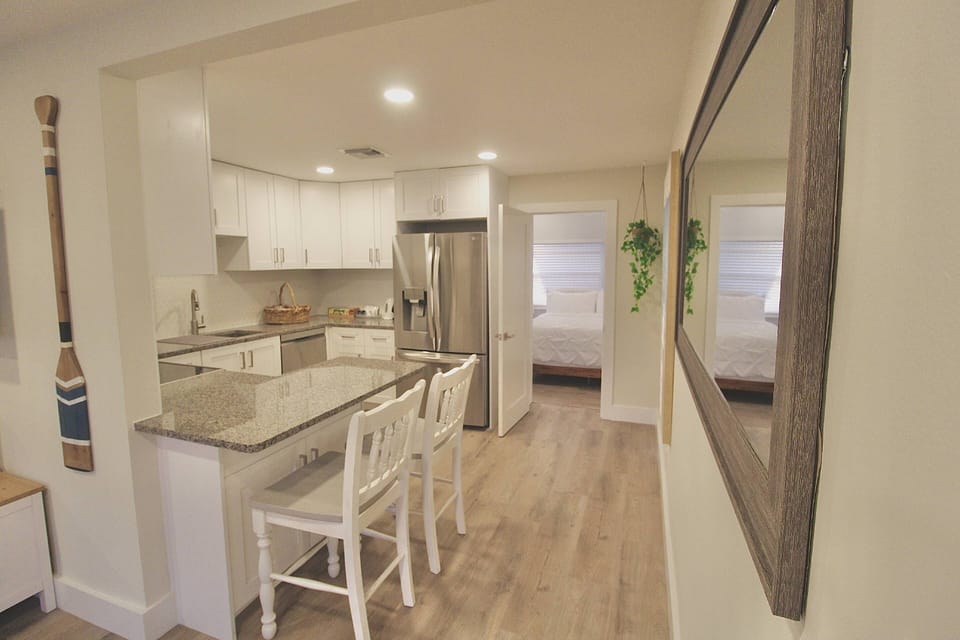 The beautiful kitchen boasts granite countertops and island bar seating.
