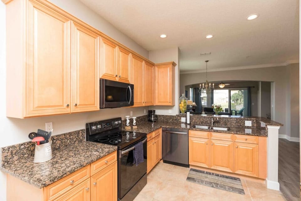 Cabinets galore full of dishes, glass ware and gourmet cooking utensils