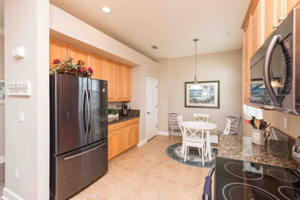 Kitchen with Black Stainless steel gourmet kitchen with upsale Samsung appliances