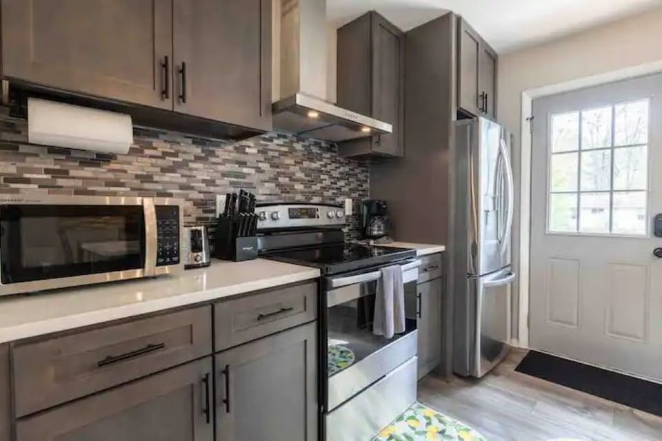 Stainless steel appliances in the kitchen, perfect for all your cooking needs!