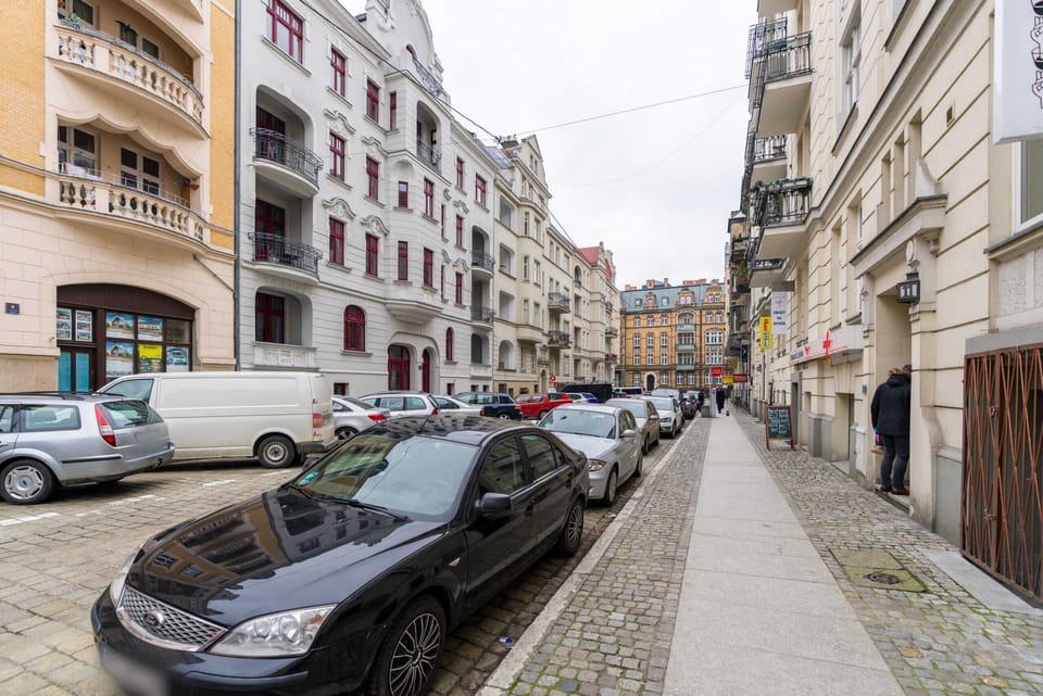 Another view of the cobblestone street, showcasing the neighborhood's unique architecture.
