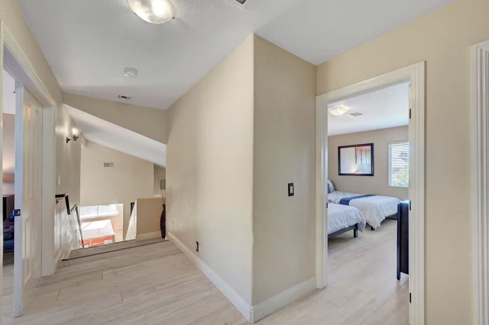 Upstairs bedroom with two queen beds. 