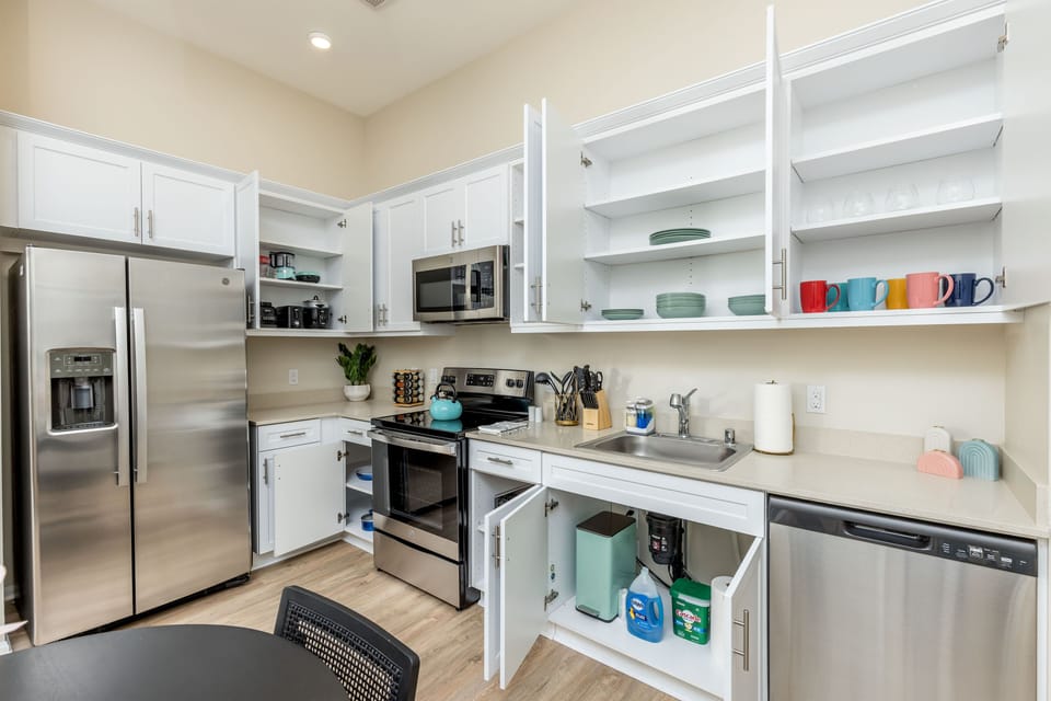This kitchen is equipped with modern appliances and plenty of space for cooking.