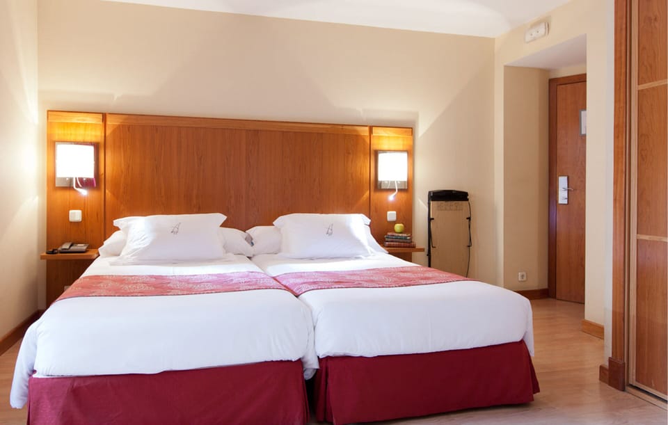 Triple Room | Down comforters, minibar, in-room safe, desk