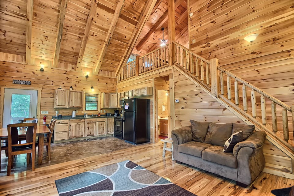 Full Kitchen, couch and stairway to upper loft