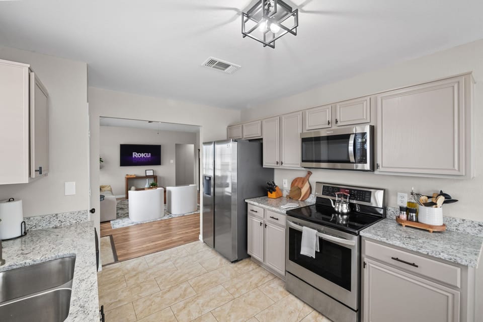Cook up a storm in this modern kitchen with sleek appliances and stylish decor!