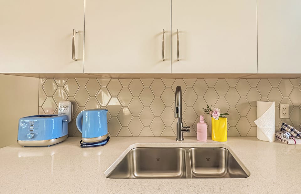 Family Townhome | Private kitchen | Coffee/tea maker, full-size fridge, microwave, dishwasher