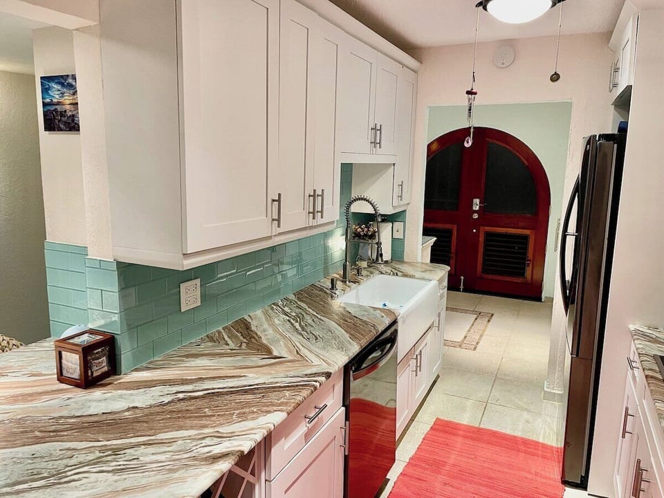 Sleek and modern kitchen with top-tier appliances and stylish finishes.