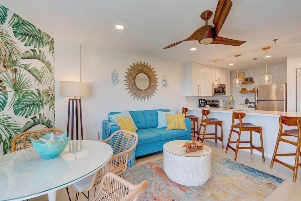 Colorful, mid-century vibe for this Keys tropical open concept living/dining area