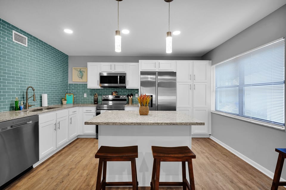 Kitchen island with extra sitting spaces and a comfortable cooking area