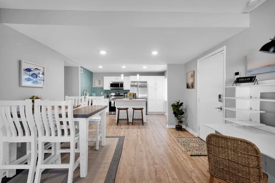 Dining area with 4 seats and separate work desk. Modern coastal style decor 