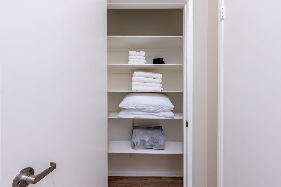 Fully stocked linen closet for bedding and towel needs.