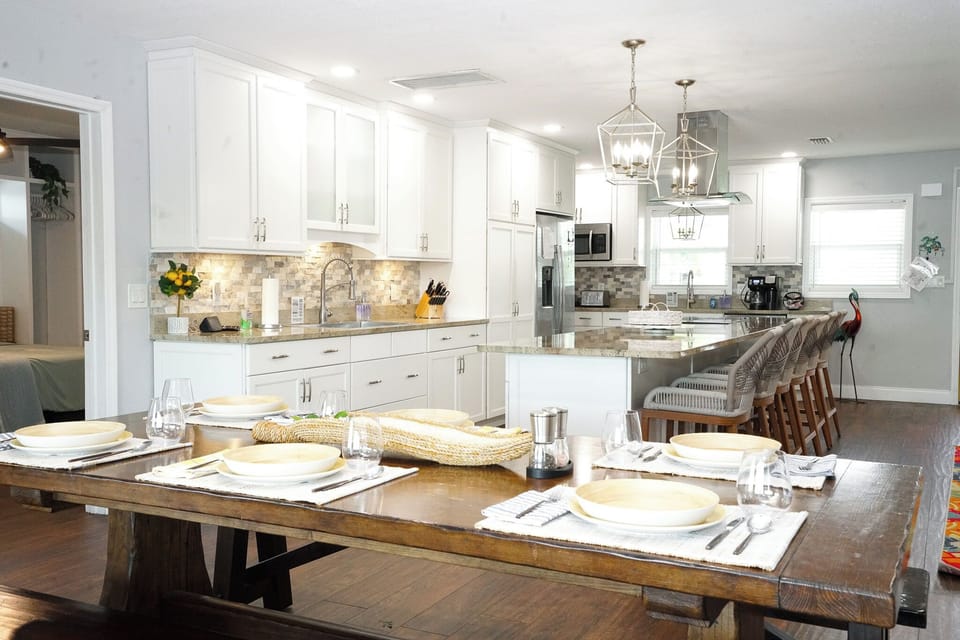 Additional dining overlooking the pool and water accommodates larger groups.