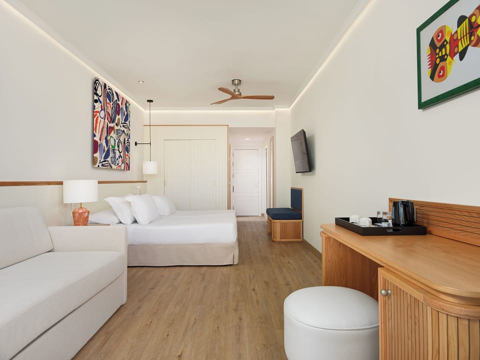Minibar, desk, bed sheets